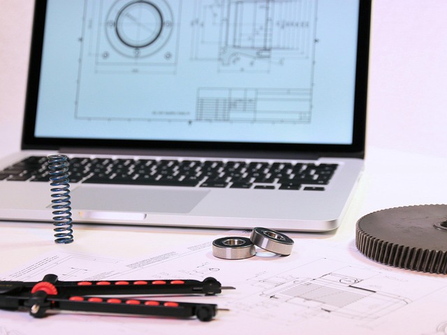 beginner model engineering notebook with gear sketch, calipers and small parts tray